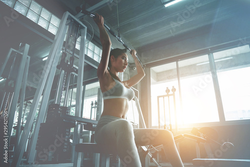 Beautiful sexy woman workout in sports gym, cinematic tone © theevening