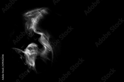 Fototapeta powder-shaped ghost on black background.