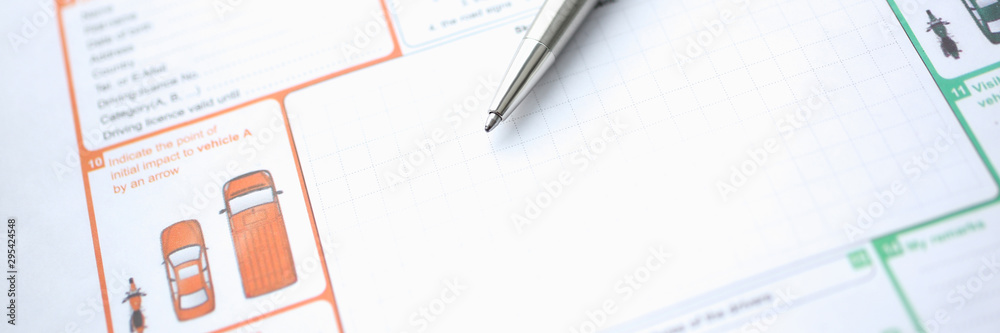 The silver pen is on the international euro-protocol form for filling and indemnification as a result of a traffic accident without police participation concept. The silver pen is on the international euro-protocol form for filling and indemnification as a result of a traffic accident without police participation concept.