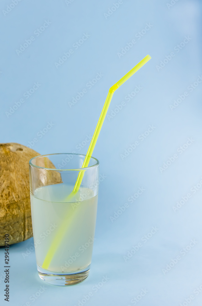 Fototapeta premium useful drink. coconut milk with a tube. coconut