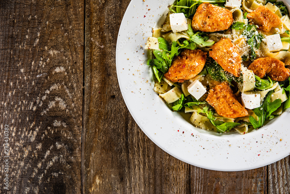 Pasta with chicken meat, feta cheese and rucola Pasta with chicken meat, feta cheese and rucola