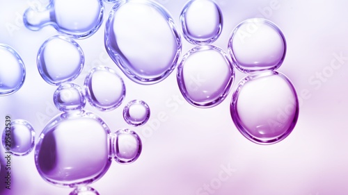 transparent gas bubbles on water surface. Worms-eye low angle with crystal bubbles in purified water on pink, purple, violet background. cosmetic backdrop with copy space