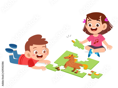 happy cute kids play solve puzzle together
