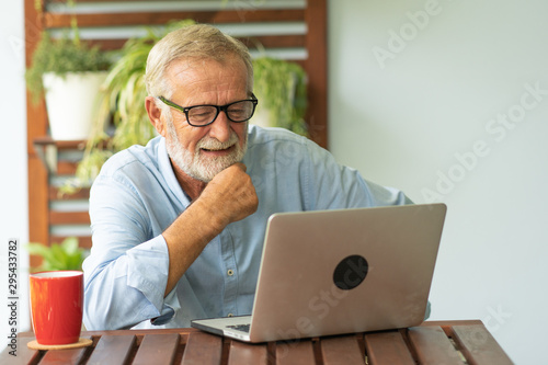 Portrait senior man using laptop for working at home, Freelance concept - Image