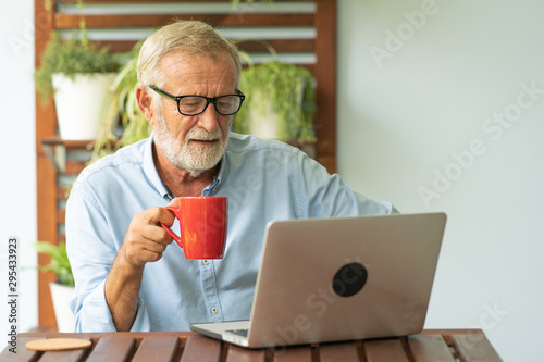 Portrait senior man using laptop for working at home, Freelance concept - Image