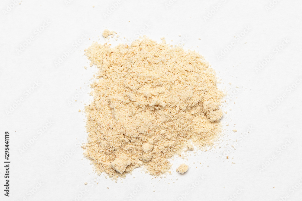 Ground ginger pile top view, powder heap, crushed dried root flour close up Ground ginger pile top view, powder heap, crushed dried root flour close up