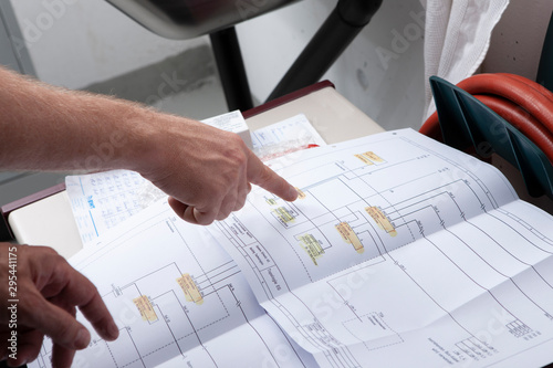 workmen and engineer working an planing on the job showing hands