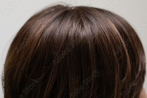 Brunettes head, healthy brown hair close up