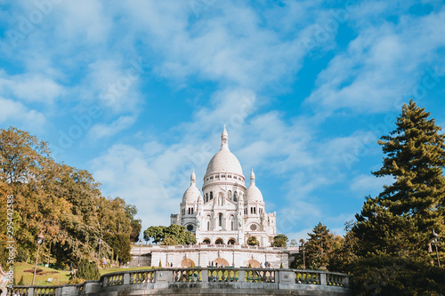 Bright sunny day bottom view from Montmartre to the Sacre Coeur Basilica - majestic against the blue bright sky © andrey gonchar