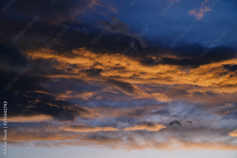 Obraz premium Dramatic sky with orange clouds. Nature background.