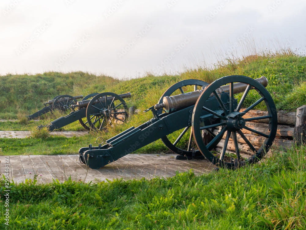 Old cannons on rampart in city Fredericia, Denmark. Three vintage mobile cannons