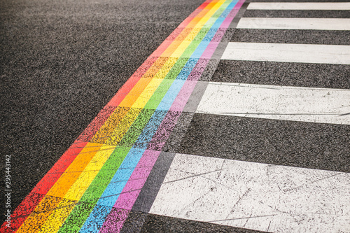 Carta da parati Rainbow markings on the pavement at a pedestrian crossing - rights of the LGBT c