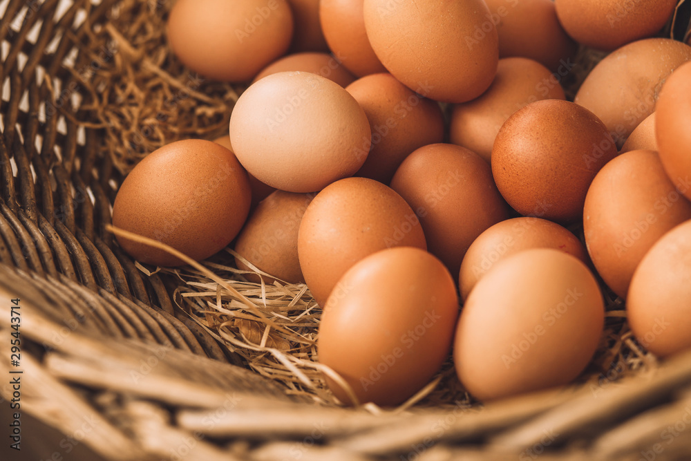 Closeup fresh eggs in wicker basket - fruit rural market Closeup fresh eggs in wicker basket - fruit rural market