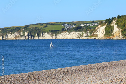 Sailing boat in Lyme Bay near Seaton, Devon photo