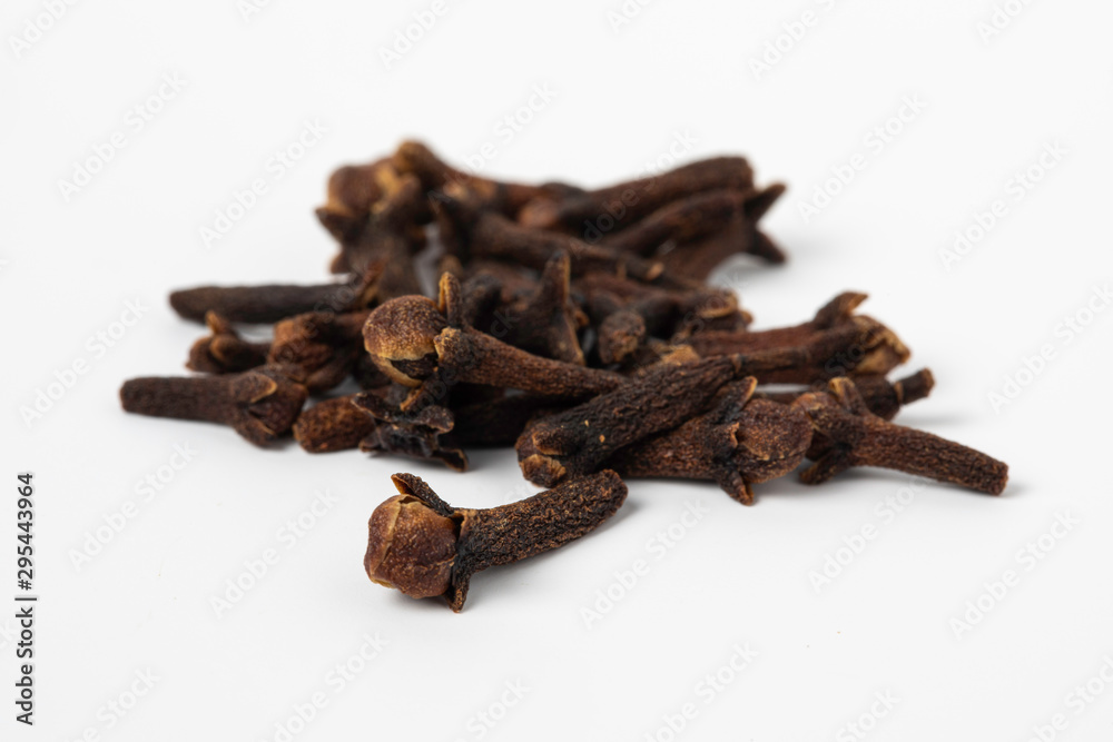 Dried cloves spices heap close up on white background Dried cloves spices heap close up on white background