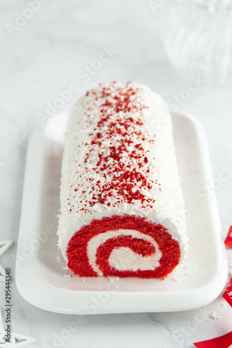 Red Velvet roll cake for Christmas with cream cheese and coconut flakes Poster Mural XXL