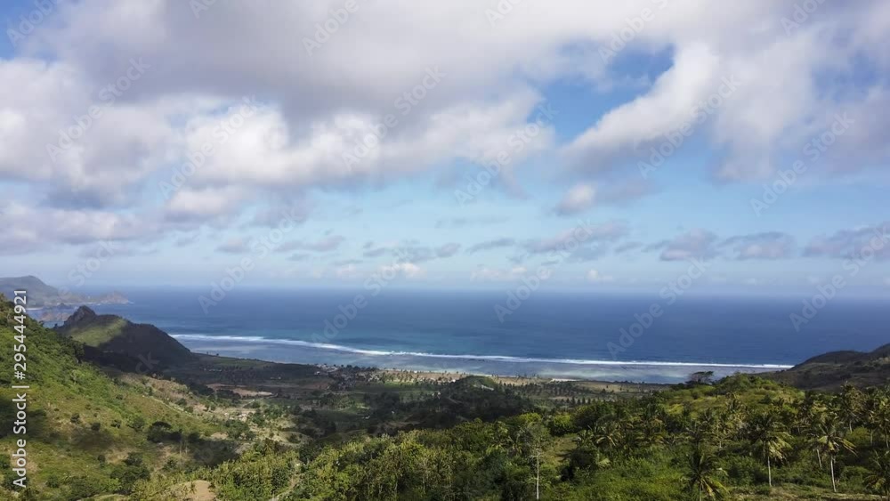 Time lapse of an indonesian beach near some green mountains, in Lombok Time lapse of an indonesian beach near some green mountains, in Lombok