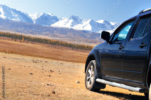 Travel concept with big 4x4 car in mountains. Car for traveling in countryside.