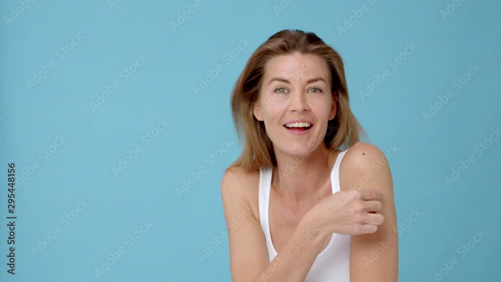 Cheerful Woman Tapping Her Shoulder with Her Pointy and Middle Finger Cheerful Woman Tapping Her Shoulder with Her Pointy and Middle Finger