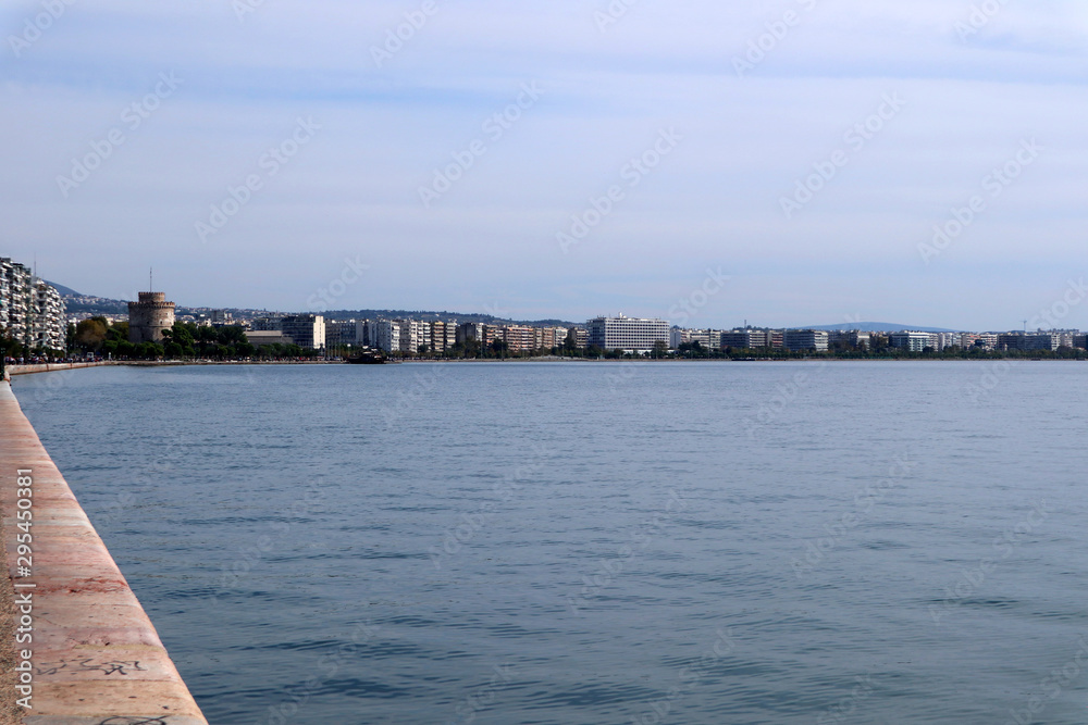 View of the city of Thessaloniki, Greece. Thermaikos Gulf and White Tower. Thessaloniki waterfront, blue sea and sky. 