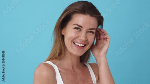Headshot of a Female Model with Flawless Skin and Dimpled Cheeks Smiling