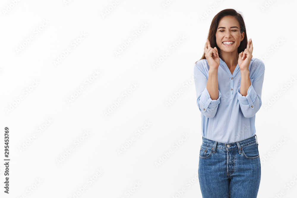 Girl have feeling luck good fortune. Optimistic adult woman with tattoo close eyes, smiling broadly, anticipating dream come true, miracle, positive results, cross fingers, praying white background Girl have feeling luck good fortune. Optimistic adult woman with tattoo close eyes, smiling broadly, anticipating dream come true, miracle, positive results, cross fingers, praying white background