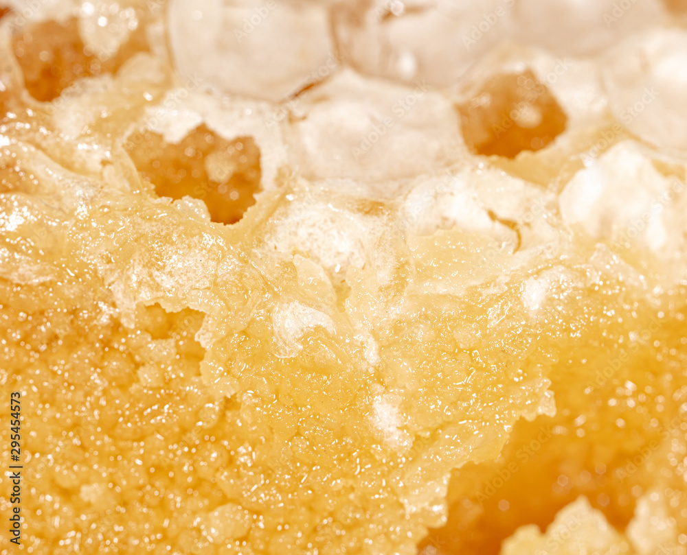 Bee honey in honeycombs as a background Bee honey in honeycombs as a background