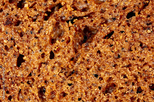 Black rye bread as an abstract background