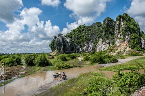 Landscape with limestone mountains in Kampong Trach, Cambodia  photo