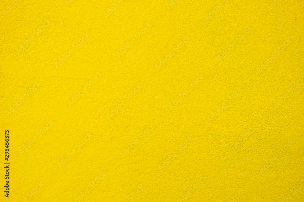 Yellow Gold Painting on Concrete Wall Texture Background.