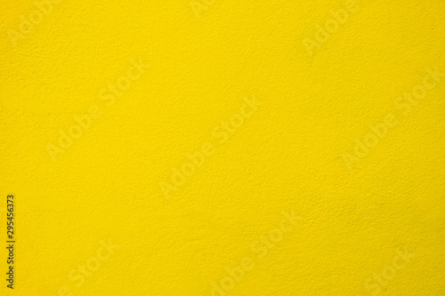 Yellow Gold Painting on Concrete Wall Texture Background.