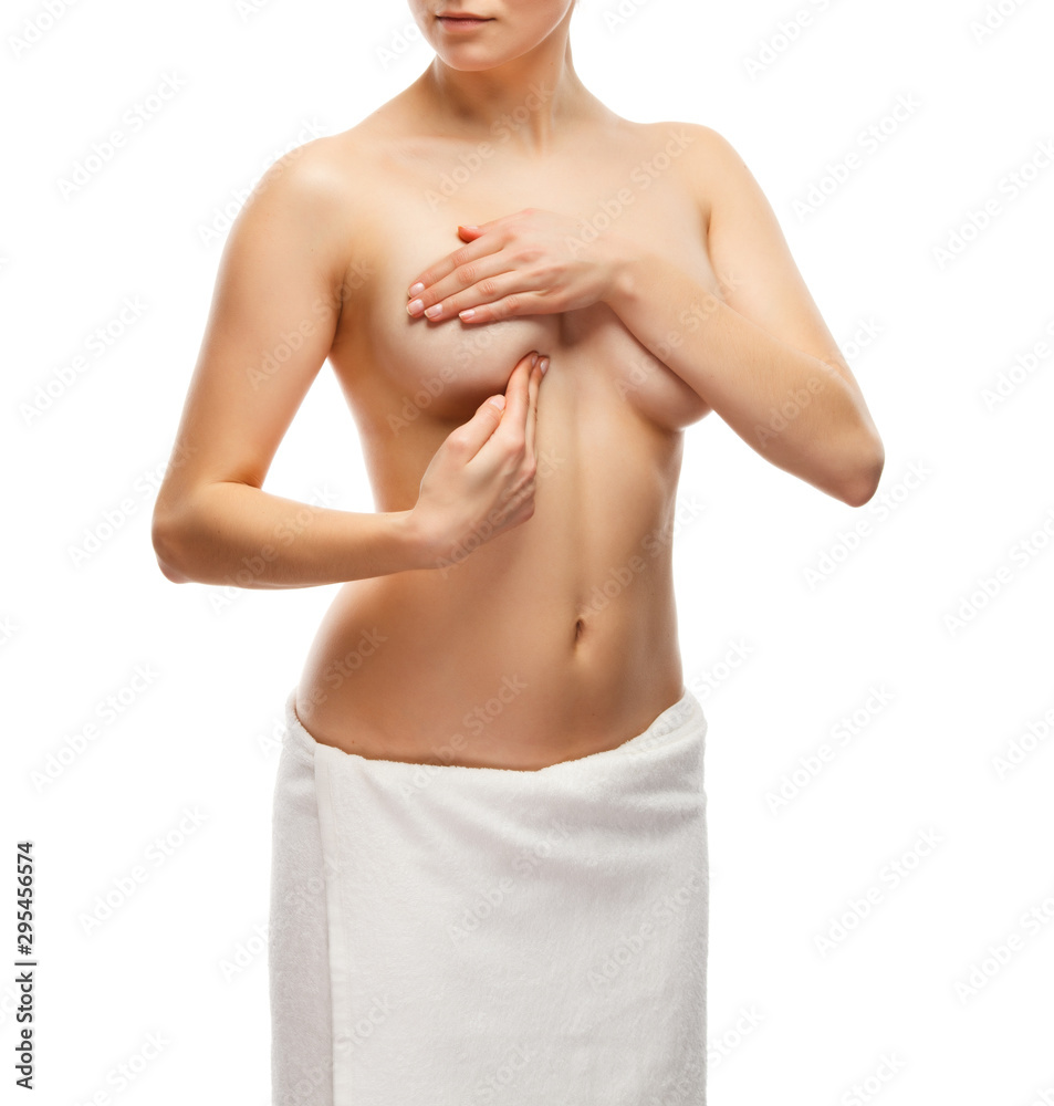 Fototapeta premium Woman examining her breast isolated on white background