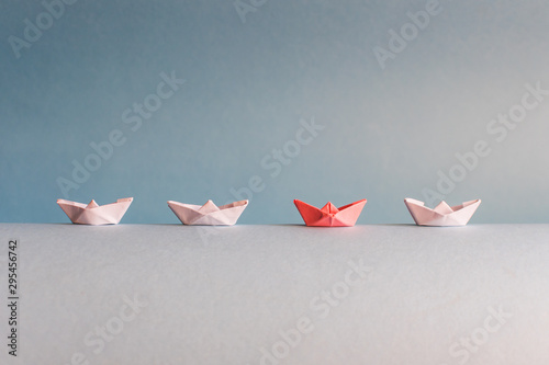 paper boat. the concept of leadership. not like everyone else.