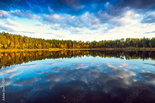 Latvian nature. Kangari lake in forest. Reflection in water.