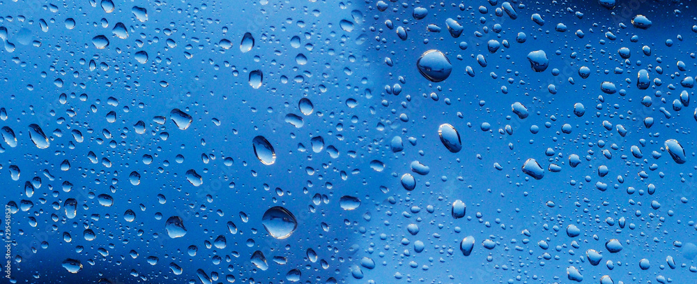 banner for website Water drop on the glass of windows background, raining on the glass off window city for background.