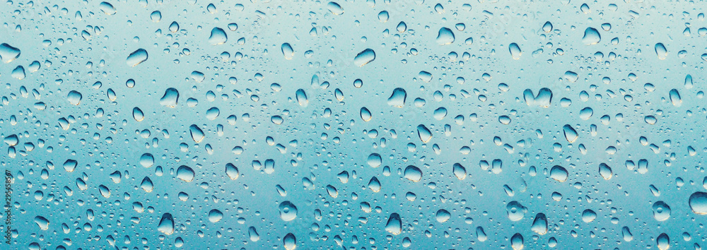 banner for website Water drop on the glass of windows background, raining on the glass off window city for background. banner for website Water drop on the glass of windows background, raining on the glass off window city for background.