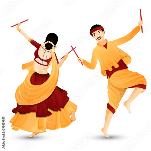 Young couple character dancing with dandiya sticks. photo