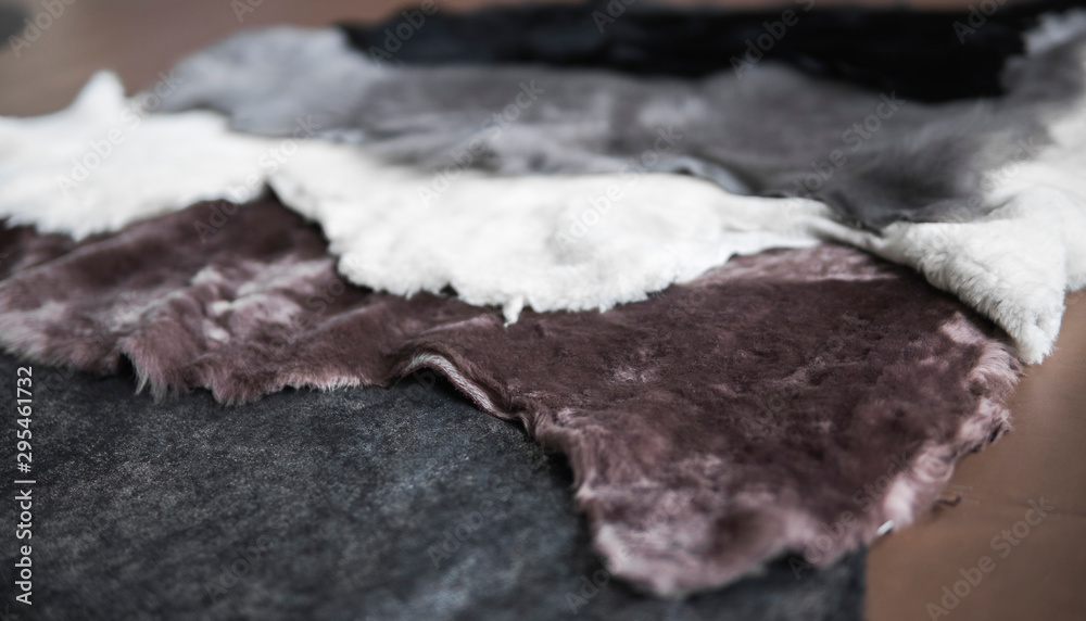 Fototapeta premium Solid fur pieces of different colors for use in sewing warm and comfortable shoes at a shoe factory.