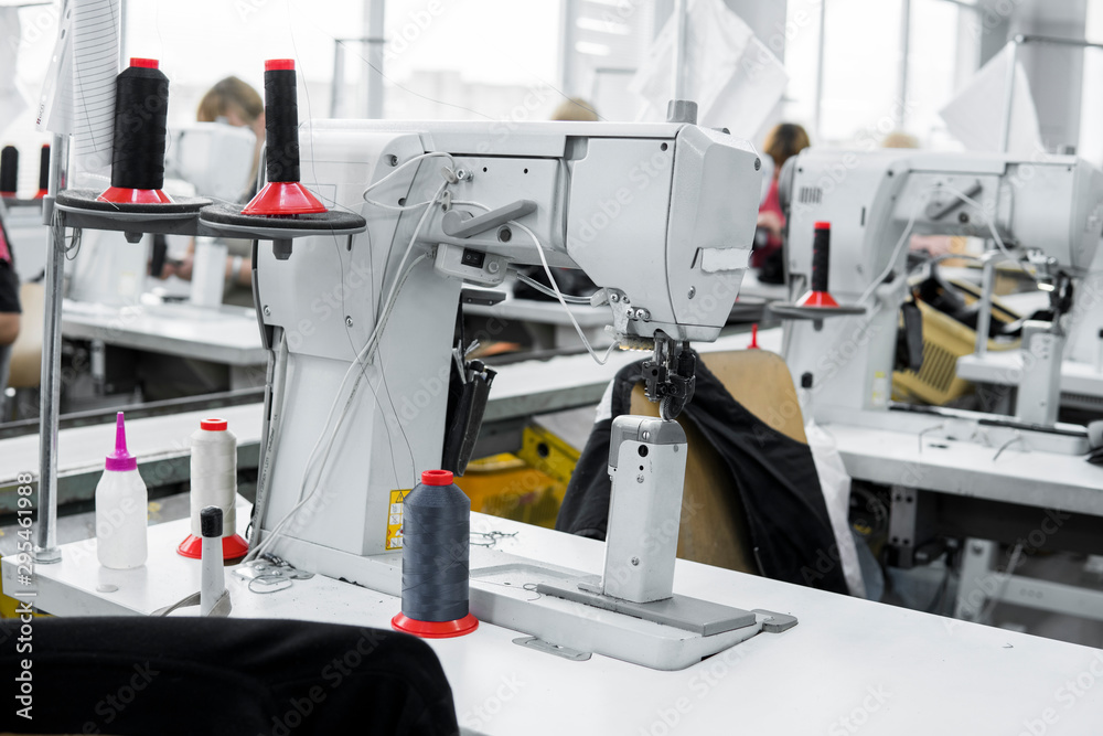 Professional sewing machine with black thread on a shoes factory. Professional sewing machine with black thread on a shoes factory.