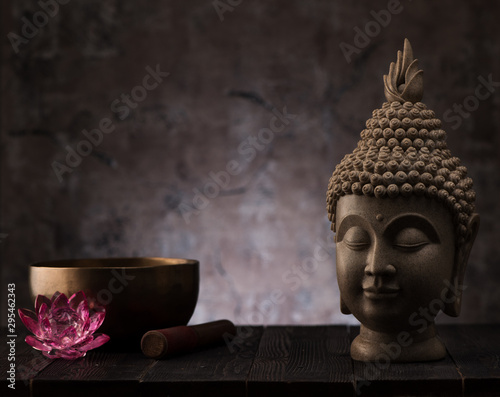 Photography Buddha head statue and singing bowl