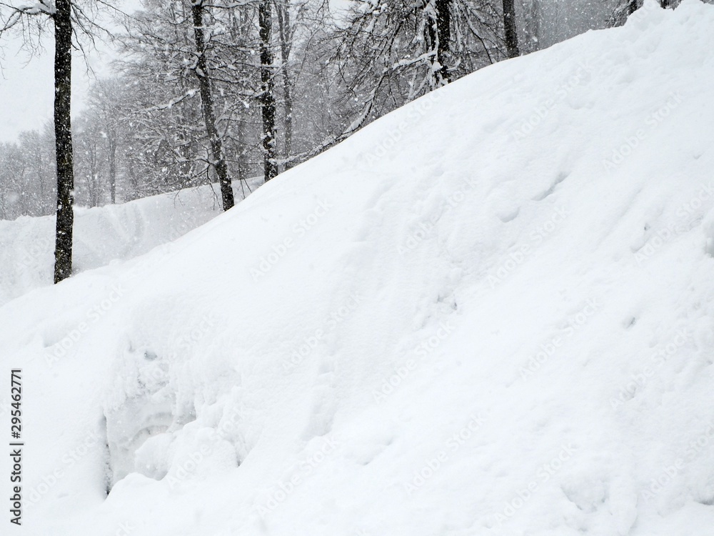 Winter landscape in the mountains of the Caucasus. Snowing.