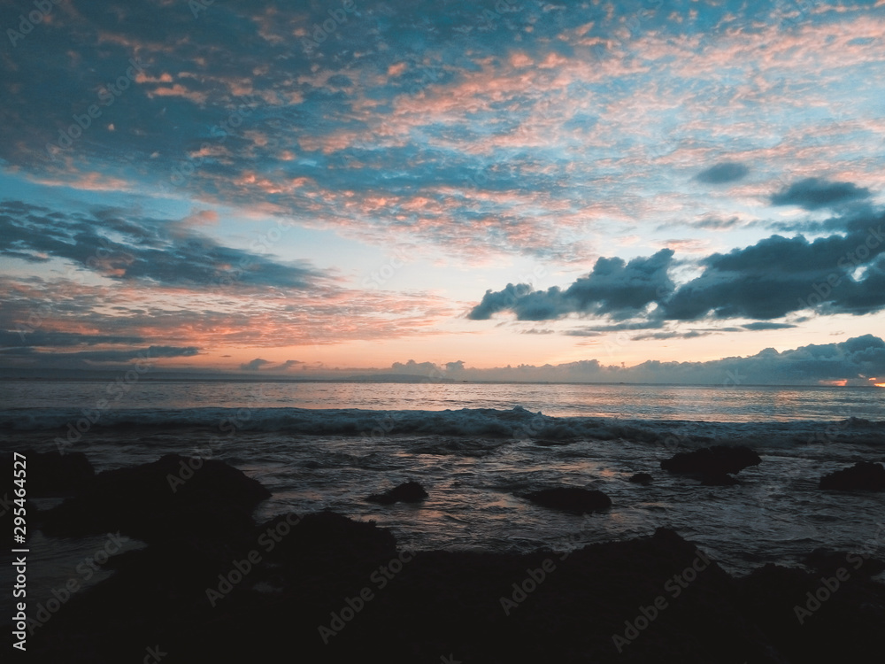 Fototapeta premium Pangandaran is one of West Java’s best kept-secrets as far as international tourists are concerned. Pangandaran offers uniquely black and white sand, calm waved beaches and spectacular sun