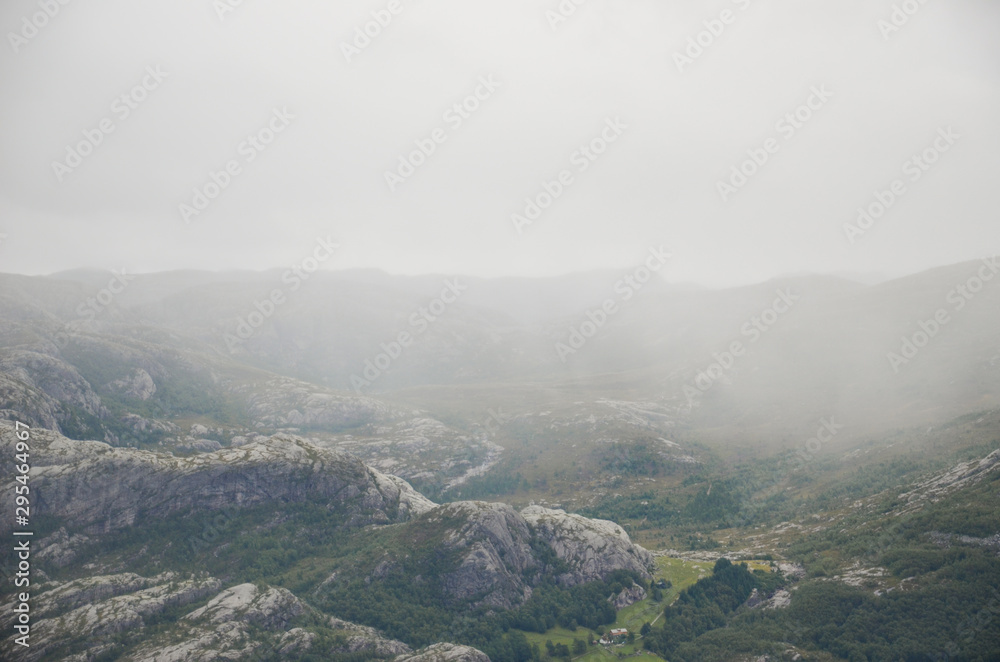 Obraz premium Magical scenic view from the cliff Preikestolen In the Norwegian mountains. Fjord and mountains.