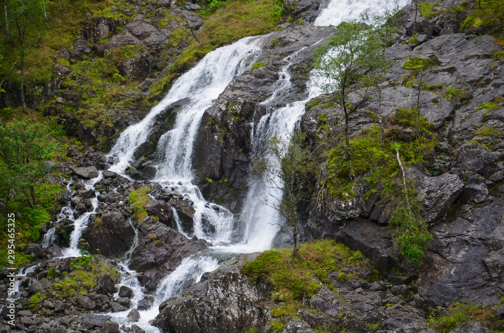 Gigantic beautiful waterfall in the Norwegian mountains. Scenic and moody.