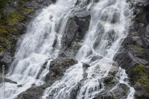 Gigantic beautiful waterfall in the Norwegian mountains. Scenic and moody.