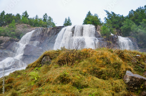 Gigantic beautiful waterfall in the Norwegian mountains. Scenic and moody.