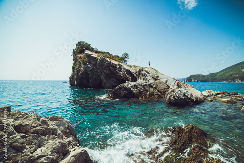 Fototapeta Naklejka Na Ścianę i Meble -  Adriatic coast in summer. The height of the tourist season. Transparent warm sea and mountains. Montenegro.