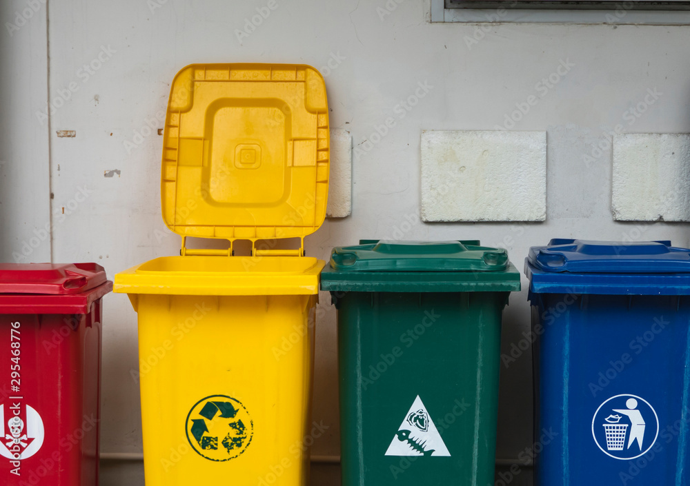 Garbage Trash Bins for collecting a recycle materials. Garbage trash bins for waste segregation. Separate waste collection food waste, plastic, paper and danger waste. Recycling. Environment. Garbage Trash Bins for collecting a recycle materials. Garbage trash bins for waste segregation. Separate waste collection food waste, plastic, paper and danger waste. Recycling. Environment.