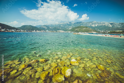 Adriatic coast in summer. The height of the tourist season. Transparent warm sea and mountains. Montenegro.