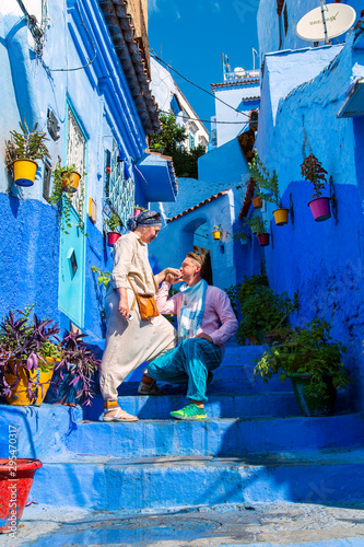 Loving couple in the famous blue city. © lizavetta